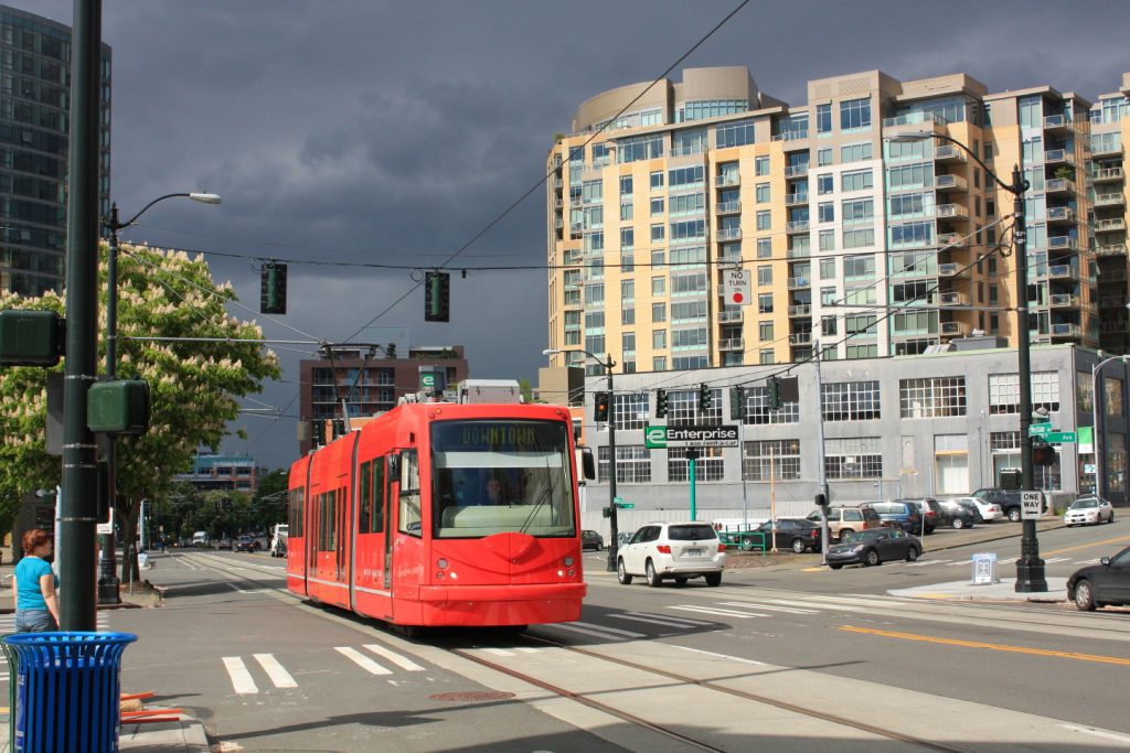 A downtown-bound street car glides through South Lake Union, the neighborhood that Amazon will soon call home.